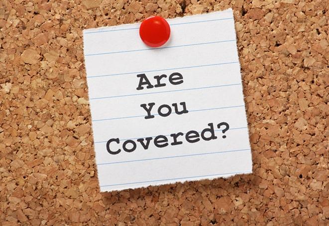 hand holding motorcycle insurance policy document in Meigs